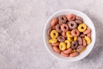 Colorful cereal rings in bowl.