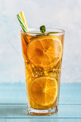 Iced tea with lemon slices and mint.