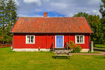 Traditional red architecture of wooden cottage house in Sweden
