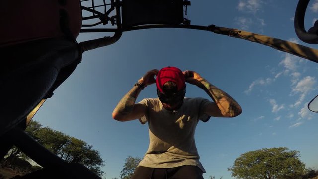 Gopro shot of a young man being excited about driving dune buggy