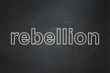 Politics concept: text Rebellion on Black chalkboard background