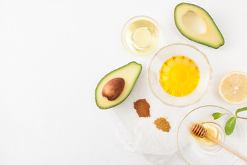 Recipes avocado with honey on white background