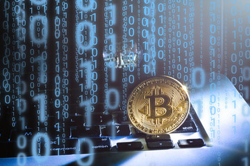 Golden bitcoin new currency, accepting bitcoin for payment, finance concept, laptop copy space