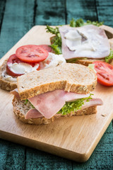 club sandwich on green wood