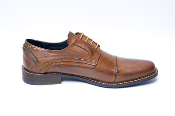 Male brown leather shoe on white background, isolated product, comfortable footwear.