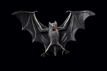Rubber Bat toy isolated on a black background stock photo images. Halloween decoration with bat animal stock photo. Black bat toy on a dark background © betka82