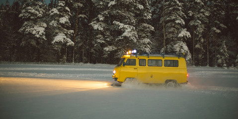 Obraz premium vintage ussr yellow van winter snow forest