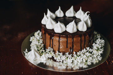 A home made cake covered by chocolate