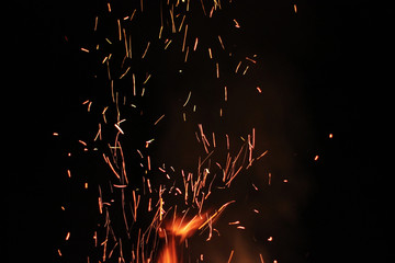 Sparks on a black background. Sparks of fire. Fire. Background. Texture. Eruption