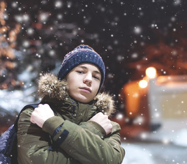 serious young man on a city street