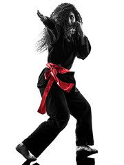 one caucasian woman practicing martial arts Kung Fu Pencak Silat in studio isolated on white background