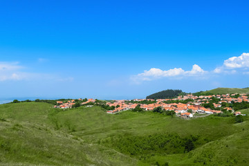 Village on a green hill, Romania