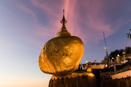 Kyaikhtiyo or Kyaiktiyo pagoda, Golden Rock, Myanmar with pilgrims during sunset