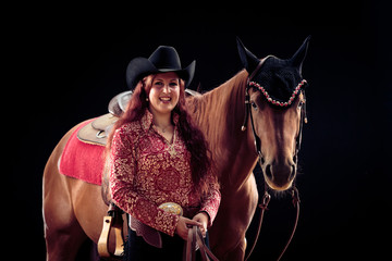 Fototapeta na wymiar Cowgirl With Her Horse