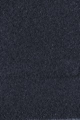 Granite rock closeup background, stone texture, cracked surface