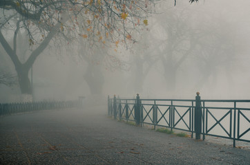 foggy day in Ioannina with pamvotida lake covered in dense fog.Typical wintry scenery. Ioannina is...
