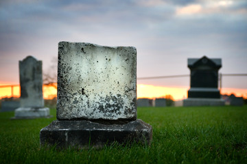 Sad grave stone evening falling