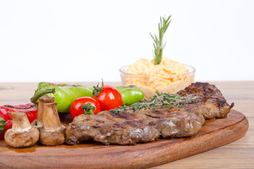 Grilled Steak Served on Wooden Plate
