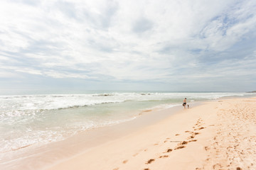 Fototapeta na wymiar Sri Lanka - Ahungalla - Out for a calming beach walk