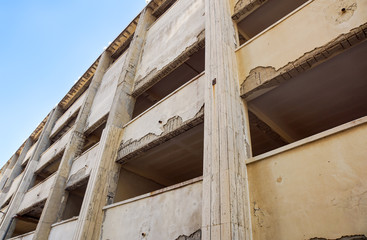 Structure of an abandoned unfinished concrete building.