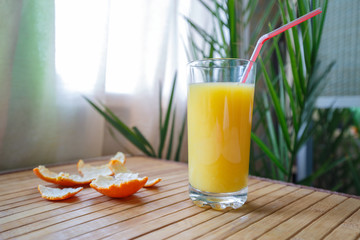 Tangerine peel and glass of juce