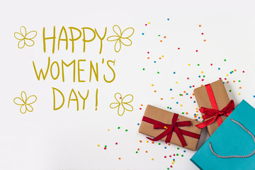 Festive Composition. Gifts and Gift Pack on the White Background. . Added the text of Happy Women's Day