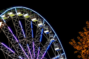 detail of a night-time panorama wheel lit by lights