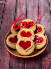 Homemade Cookies with a Red Jam Heart Valentine's Day Dark Wooden Background Copy Space