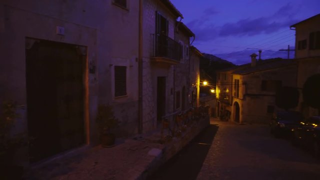 Medieval narrow cobblestone street in Valdemossa village at night