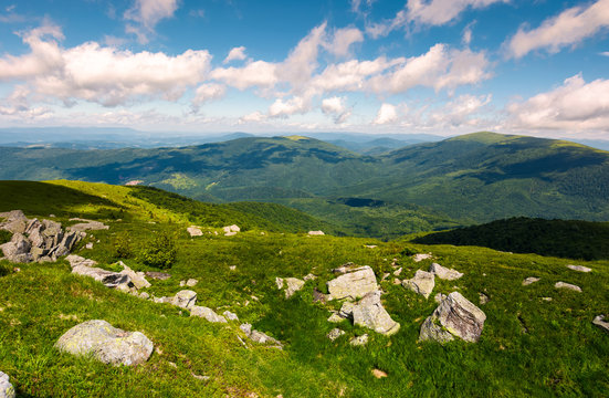 grassy meadow with rocky formations in mountains. lovely summer landscape. location Runa mountain, Carpathians, Ukraine