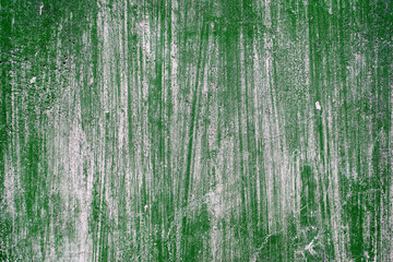 The textured background. Old concrete wall green with paint scratches