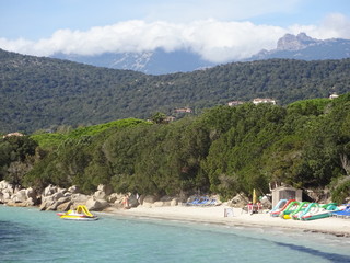 Fototapeta na wymiar Corsica - Santa Giulia bay with mountains in the background