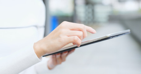 Woman use of tablet at outdoor
