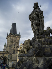 Fototapeta na wymiar Statues and Lesser Town Bridge Tower at Charles Bridge, Lesser Town, Prague, Czech Republic