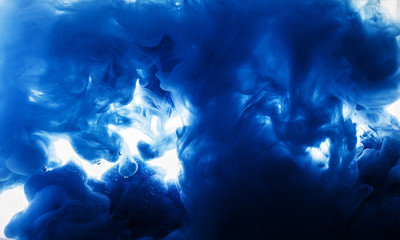 Fototapeta premium Macro photo of blue coracles in water of blue smoke clubs isolated on white background trendy abstract texture background with place for text