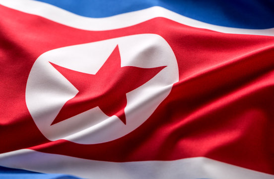North korea flag. Colorful North Korea flag waving in the wind