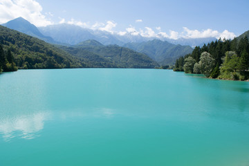 Fototapeta na wymiar Barcis lake with mountains in the background