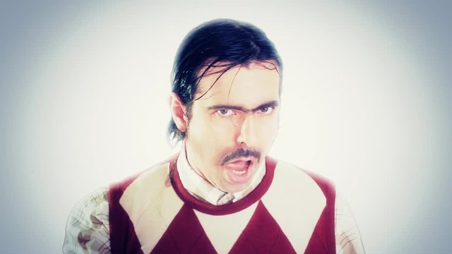 An ugly nerd licking his hair by putting saliva on his hand, then moving his tongue in a sexual way. Sickening fake character.
