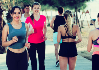 People jogging on city seafront