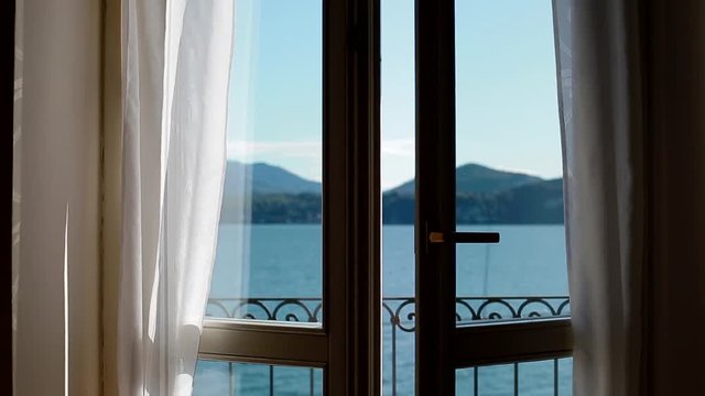 View of Lago Maggiore through opening window.