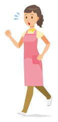 A female home helper wearing an apron is running