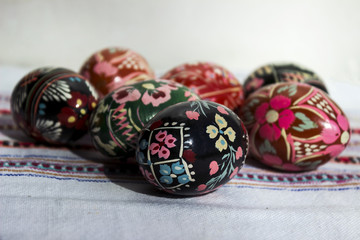 Painted eggs for Easter, Ukrainian Easter eggs and Easter eggs on the embroidered towel