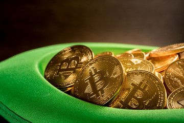 Pile of bitcoins inside green hat St Patricks Day