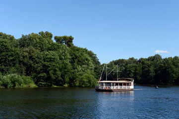 Pleasure boat on a pond in the natural-historical park 