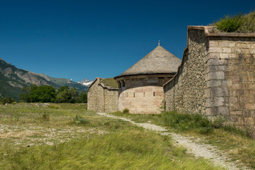 Fototapeta na wymiar Mont-Dauphin fortification with snowy Alps mountains on the background, near french city of Gap.