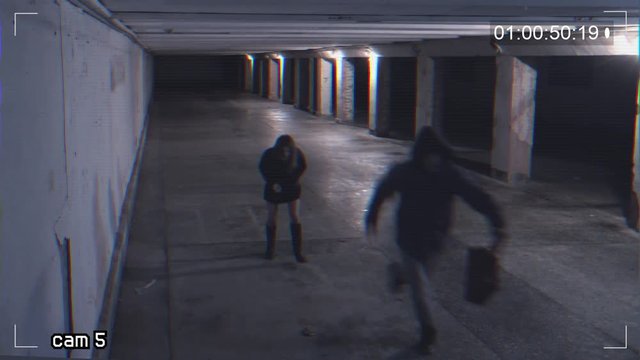 robbing a girl in an underpass. Recording from a surveillance camera