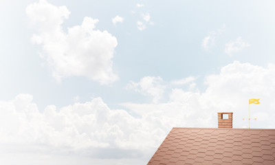 House roof as concept of suburbian real estate and construction. Mixed media