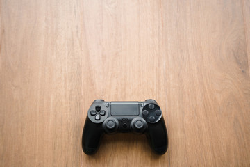 a black joystick on the beige floor. Concept video games. © galaganov