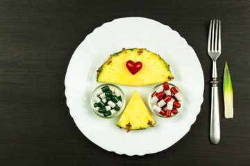 Sliced pineapple on the kitchen table. Diet food. Vitamins against influenza.