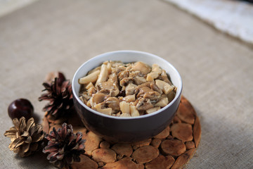 Marinated mushrooms champignons on a plate on a gray background